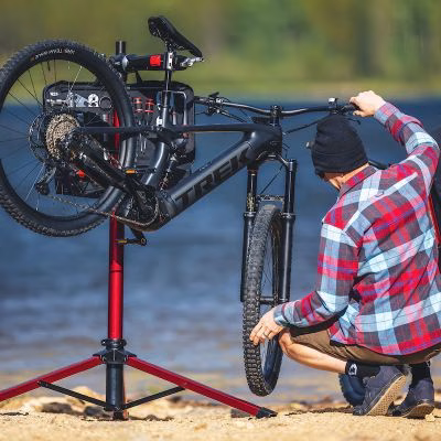 Best bike stands for heavy e-bikes UK 2026 — Feedback Sports Pro Mechanic HD repair stand holding an e-MTB